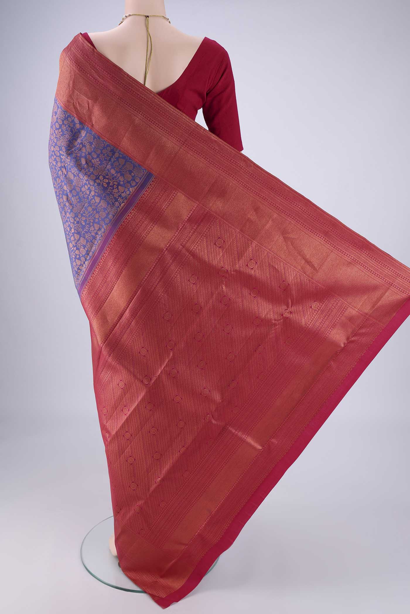 Flat view of Purple Kanchipuram Silk Saree with Zari Brocade on the body and Zari Border. 