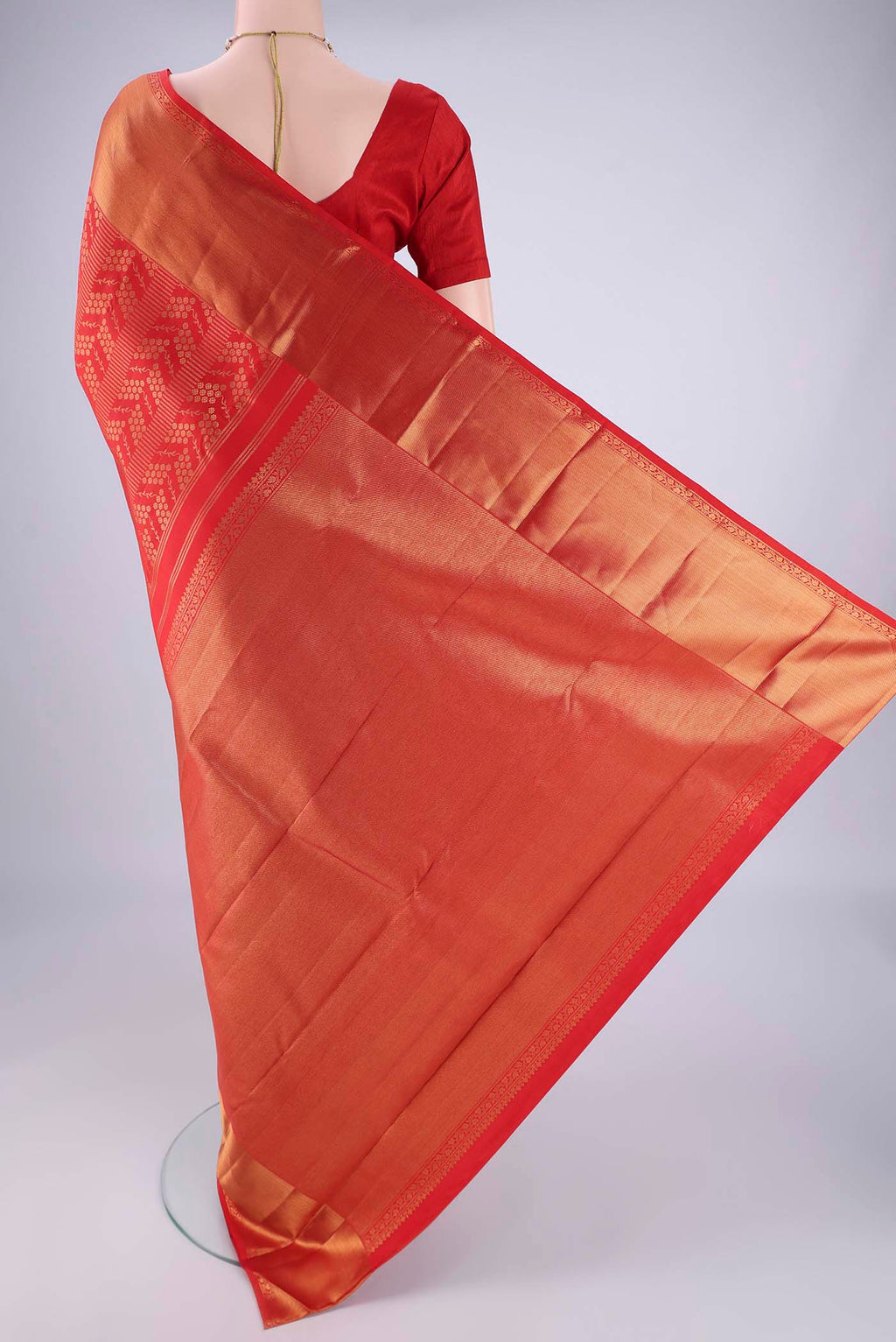 Flat view of Red Kanchipuram Silk Saree with Zari Brocade on the body and Zari Border. 