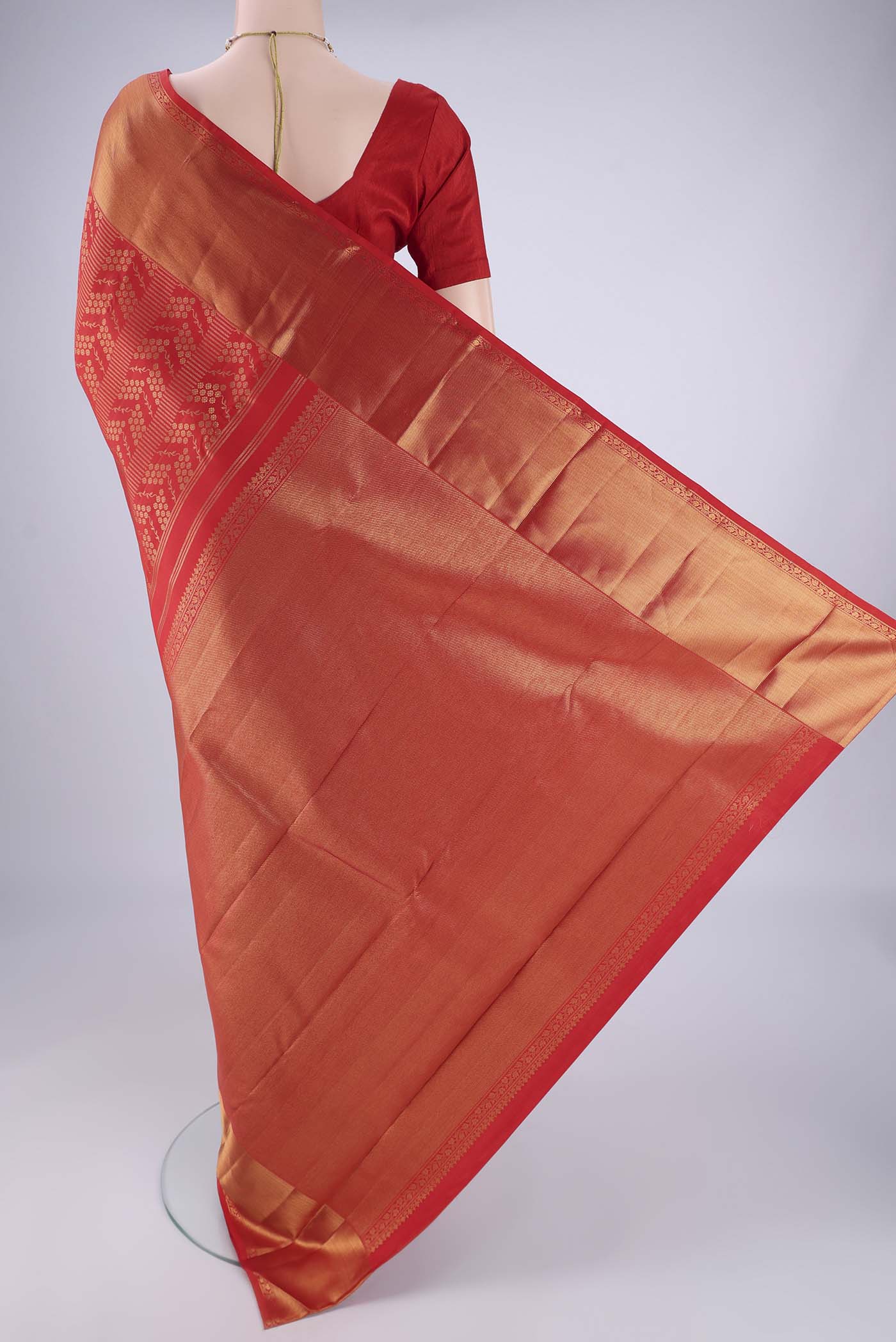 Flat view of Red Kanchipuram Silk Saree with Zari Brocade on the body and Zari Border. 