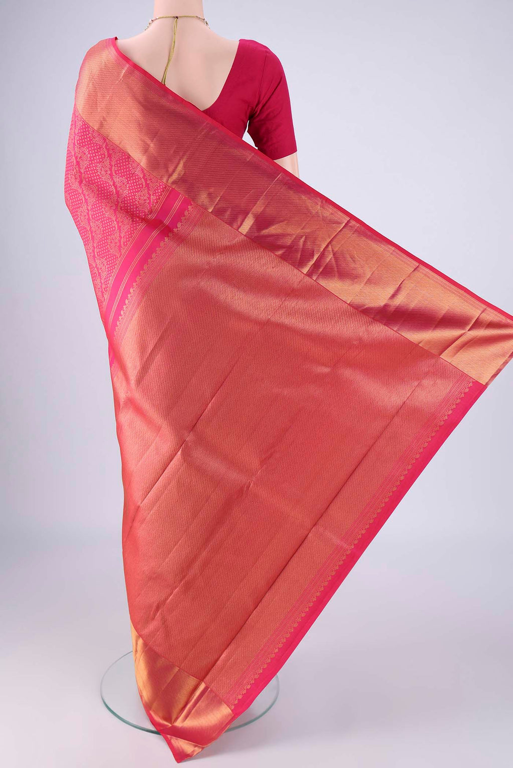 Flat view of Rani Pink Kanchipuram Silk Saree with Zari Brocade on the body and Zari Border. 