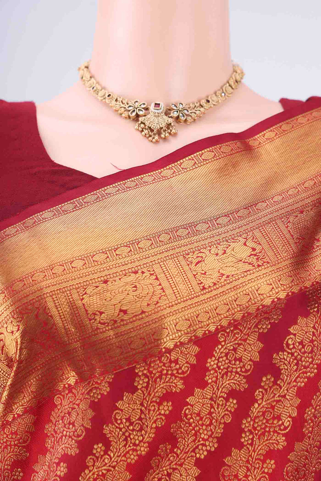 Border image of Maroon Kanjivaram Silk Saree with Zari Brocade on the body and Zari Border. 