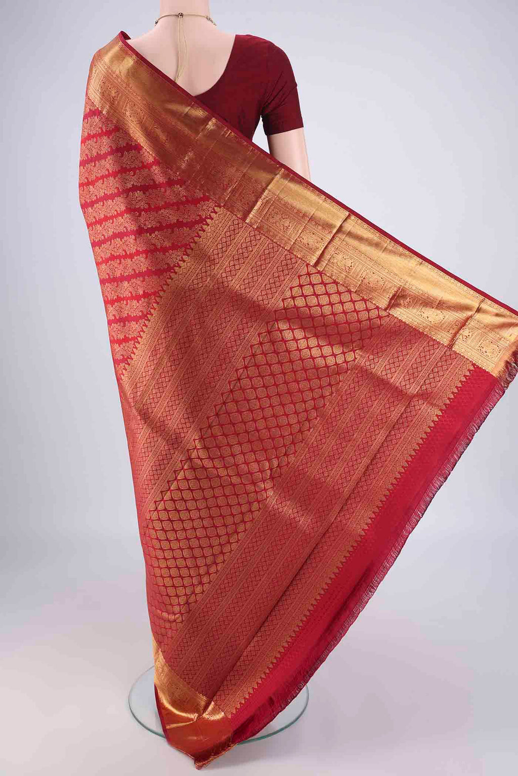 Flat view of Maroon Kanjivaram Silk Saree with Zari Brocade on the body and Zari Border. 