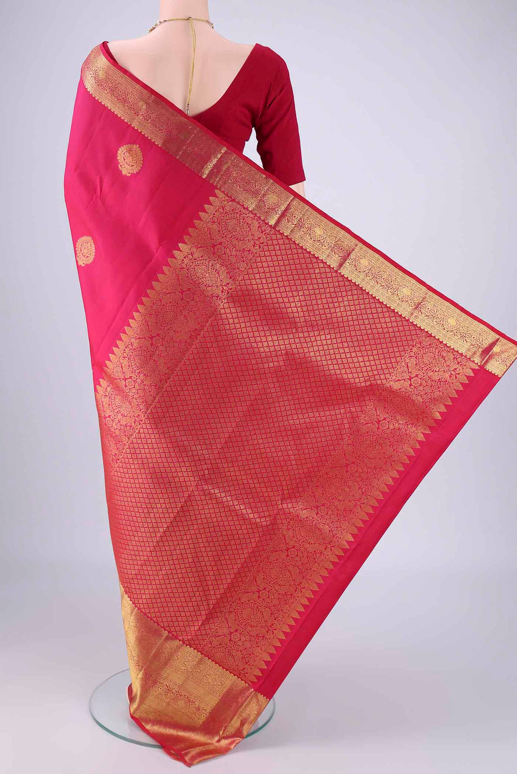 Flat view of Rani Pink Dual Tone Kanchipuram Silk Saree with Zari Butta on the body and Zari Border. 
