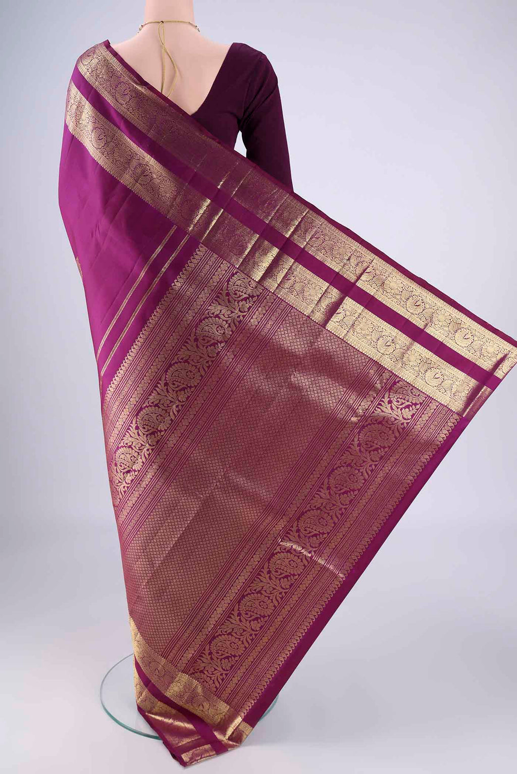 Flat view of Purple Kanchipuram Silk Saree with Zari Butta on the body and Zari Border. 