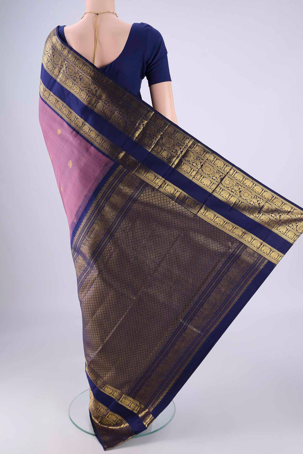 Flat view of Dark Mauve Kanchipuram Silk Saree with Zari Butta on the body and Zari Border. 