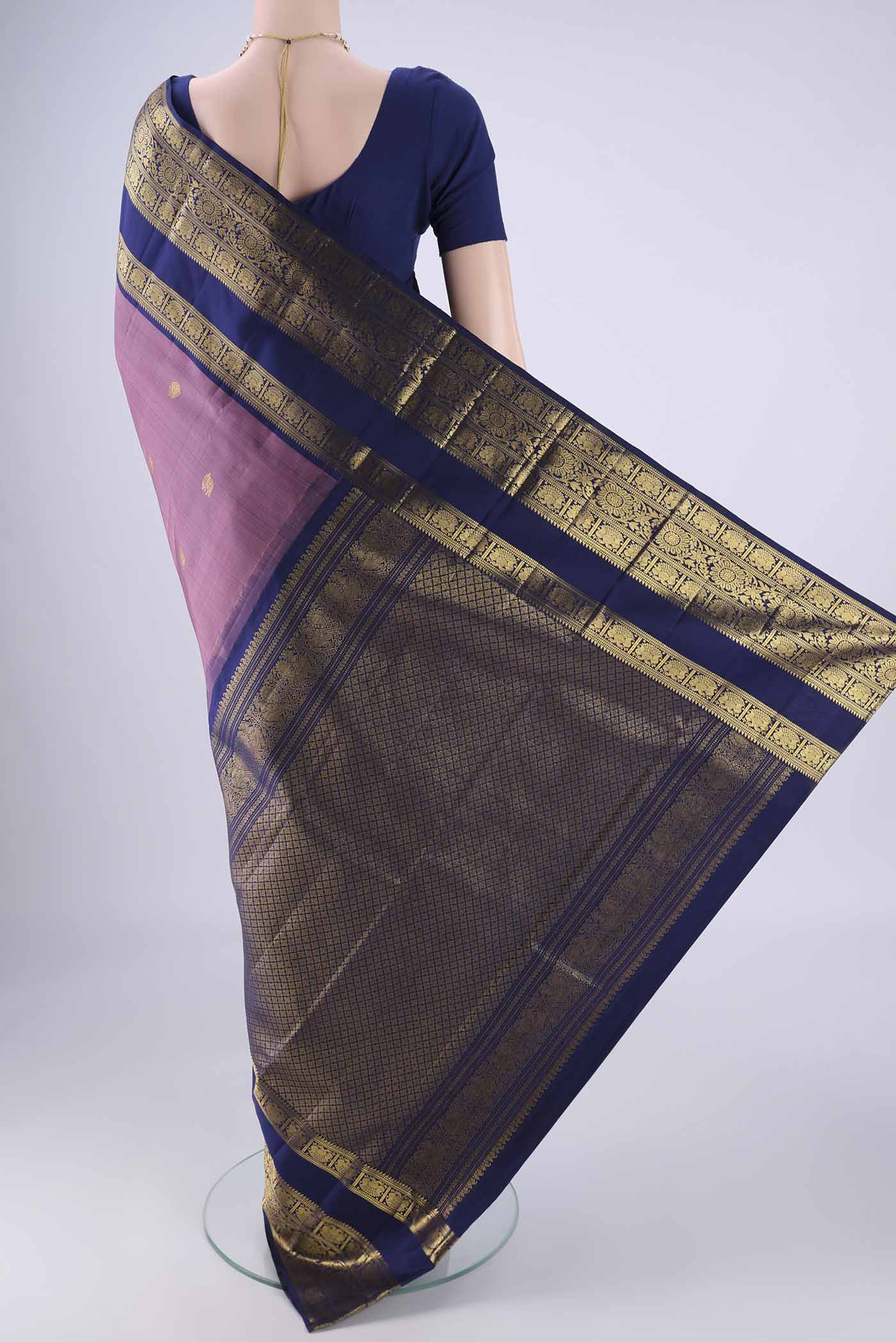 Flat view of Dark Mauve Kanchipuram Silk Saree with Zari Butta on the body and Zari Border. 
