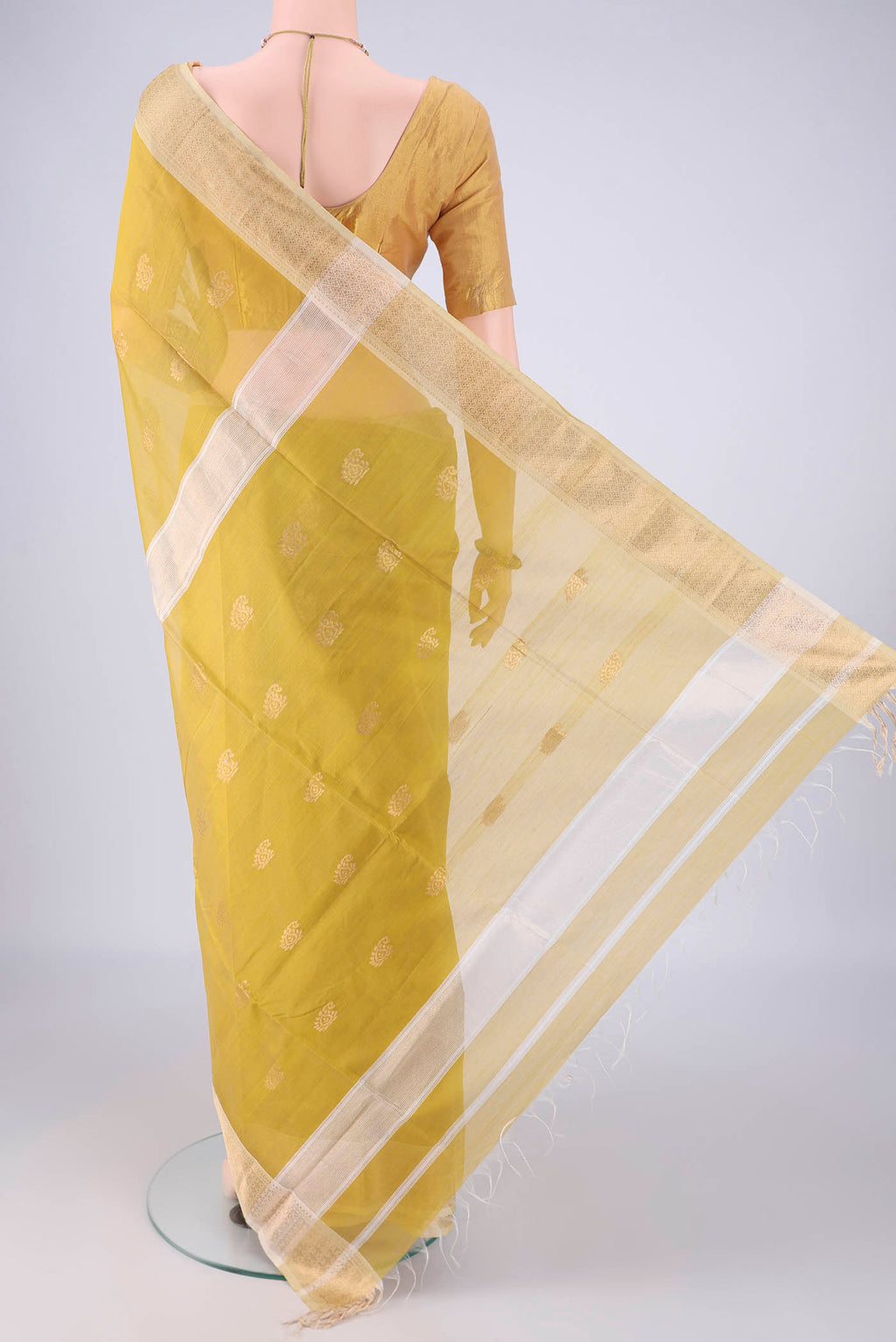 Flat view of Yellow Maheshwari Silk Cotton Saree with Zari Butta on the body and Zari Border. 