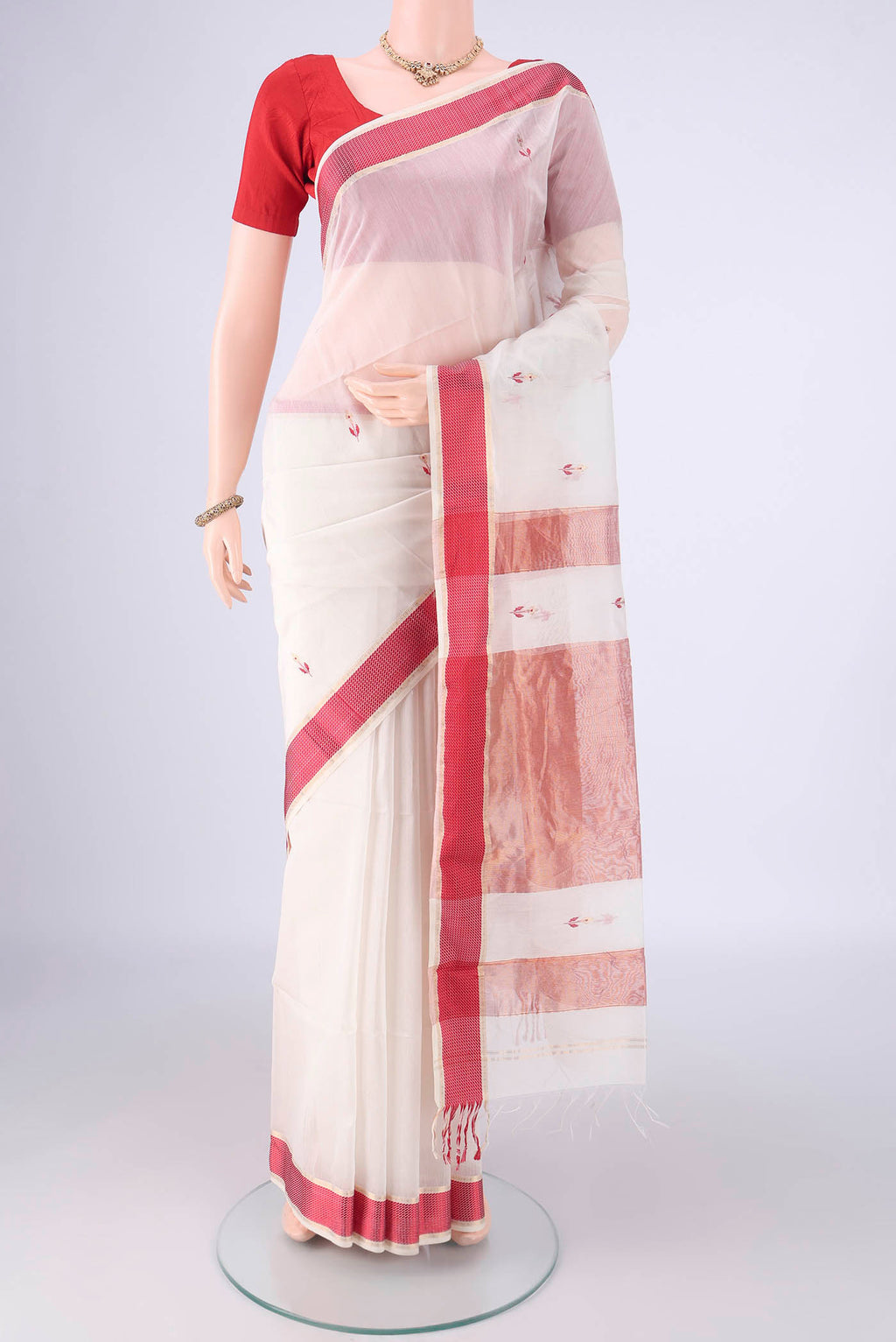 White Maheshwari Silk Cotton Saree with Zari And Thread Butta on the body and Zari And Thread Border.  displayed on a mannequin