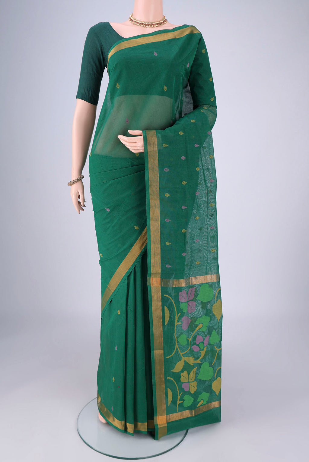 Bottle Green Uppada Cotton Saree with Thread Butta on the body and Zari Border.  displayed on a mannequin