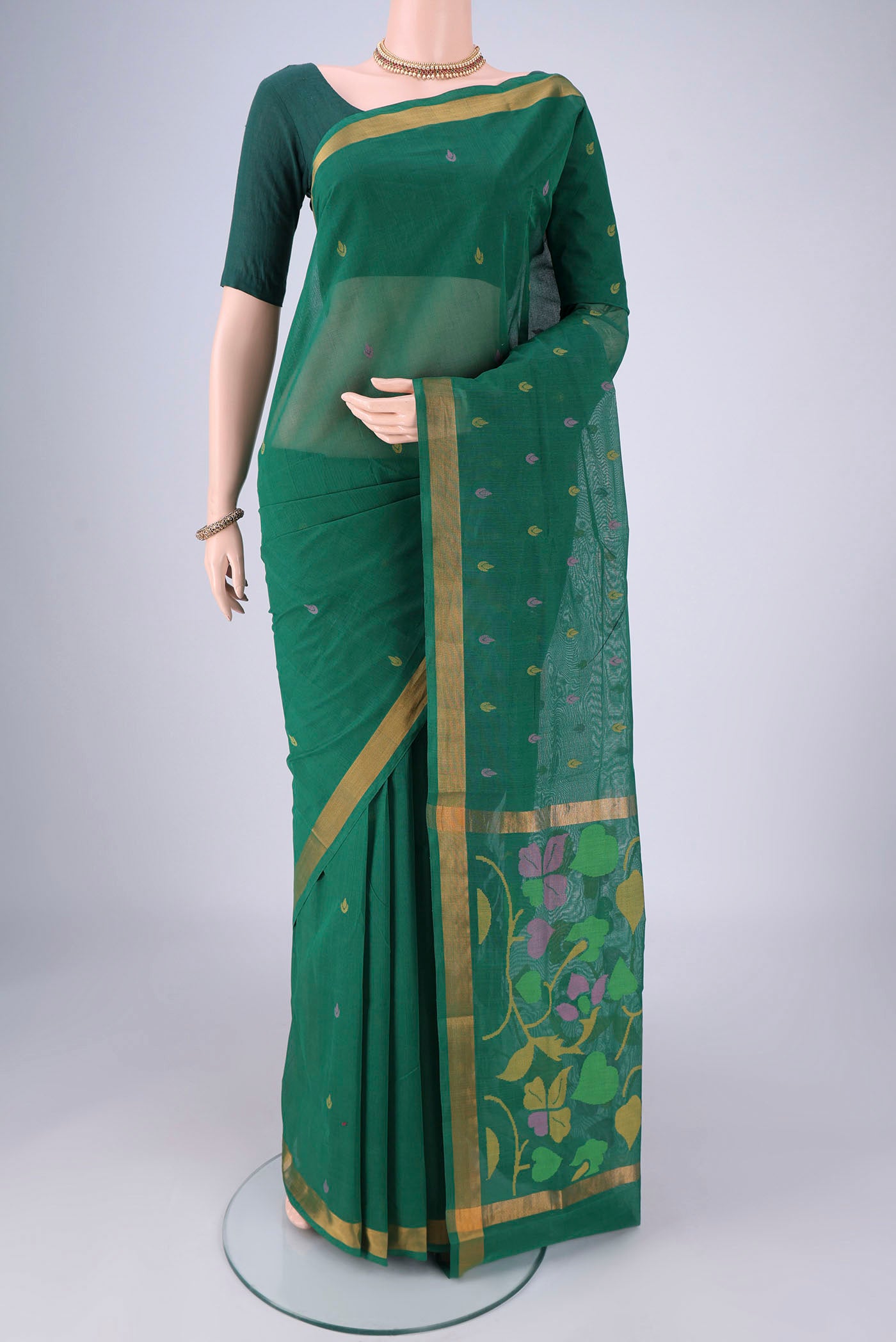 Bottle Green Uppada Cotton Saree with Thread Butta on the body and Zari Border.  displayed on a mannequin