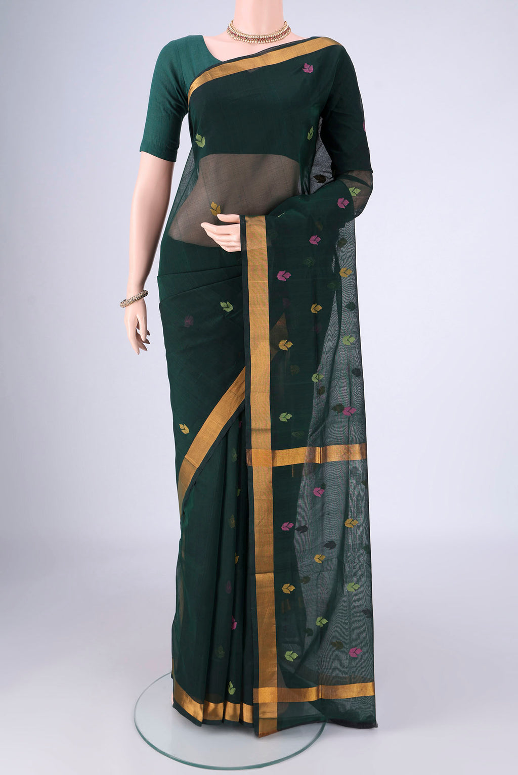 Bottle Green Uppada Cotton Saree with Thread Butta on the body and Zari Border.  displayed on a mannequin