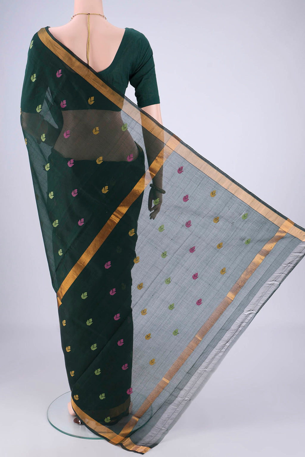 Flat view of Bottle Green Uppada Cotton Saree with Thread Butta on the body and Zari Border. 