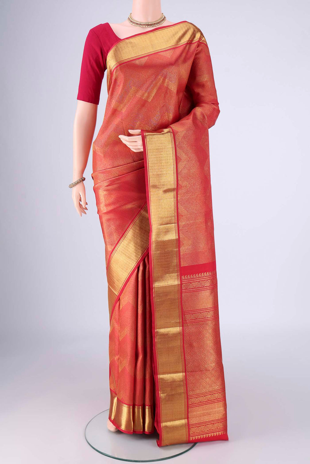 Pure Silk Pure Zari Red Kanjivaram Saree with Zari Brocade on the body and Zari Border.  displayed on a mannequin