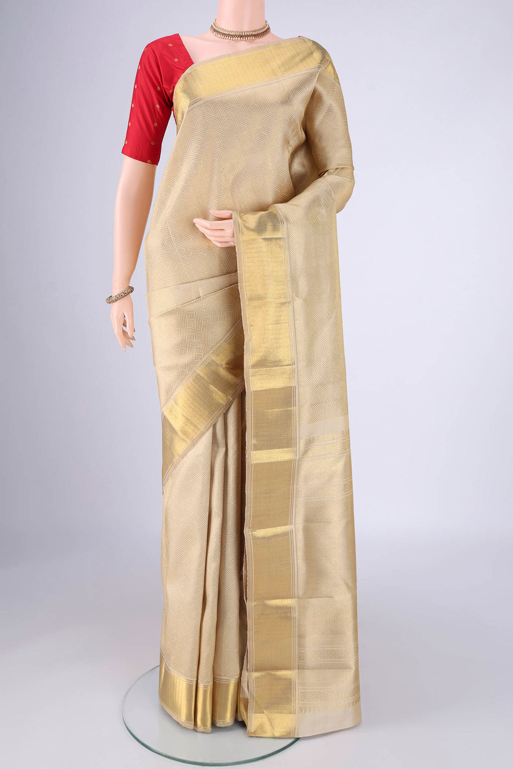 Pure Silk Pure Zari Cream Kanjivaram Saree with Zari Brocade on the body and Zari Border.  displayed on a mannequin