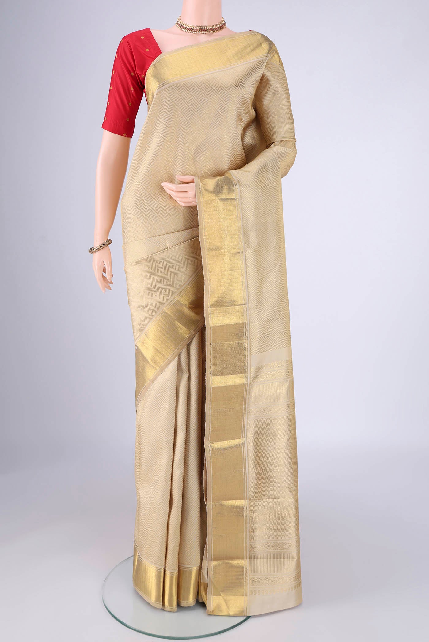 Pure Silk Pure Zari Cream Kanjivaram Saree with Zari Brocade on the body and Zari Border.  displayed on a mannequin