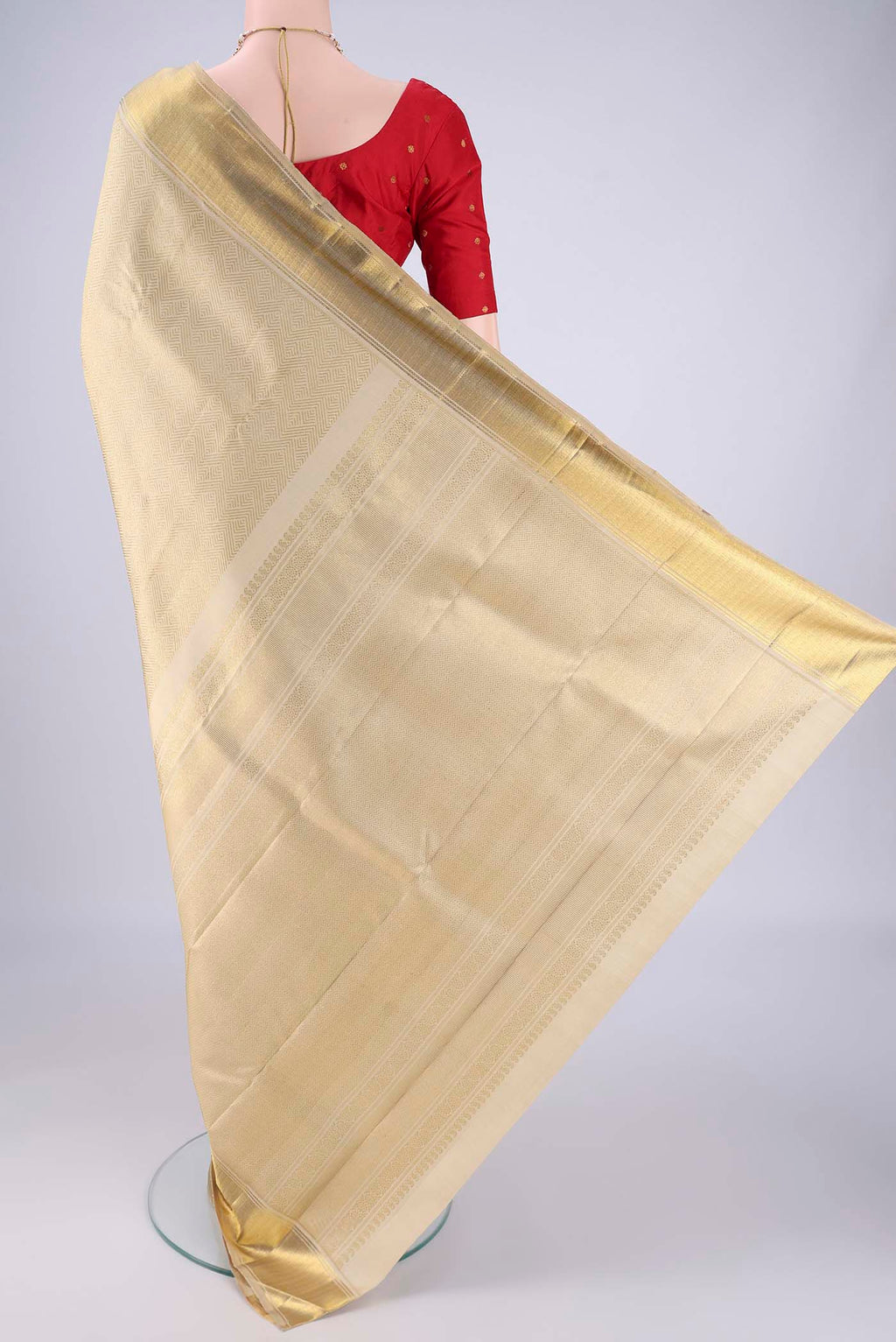 Flat view of Pure Silk Pure Zari Cream Kanjivaram Saree with Zari Brocade on the body and Zari Border. 