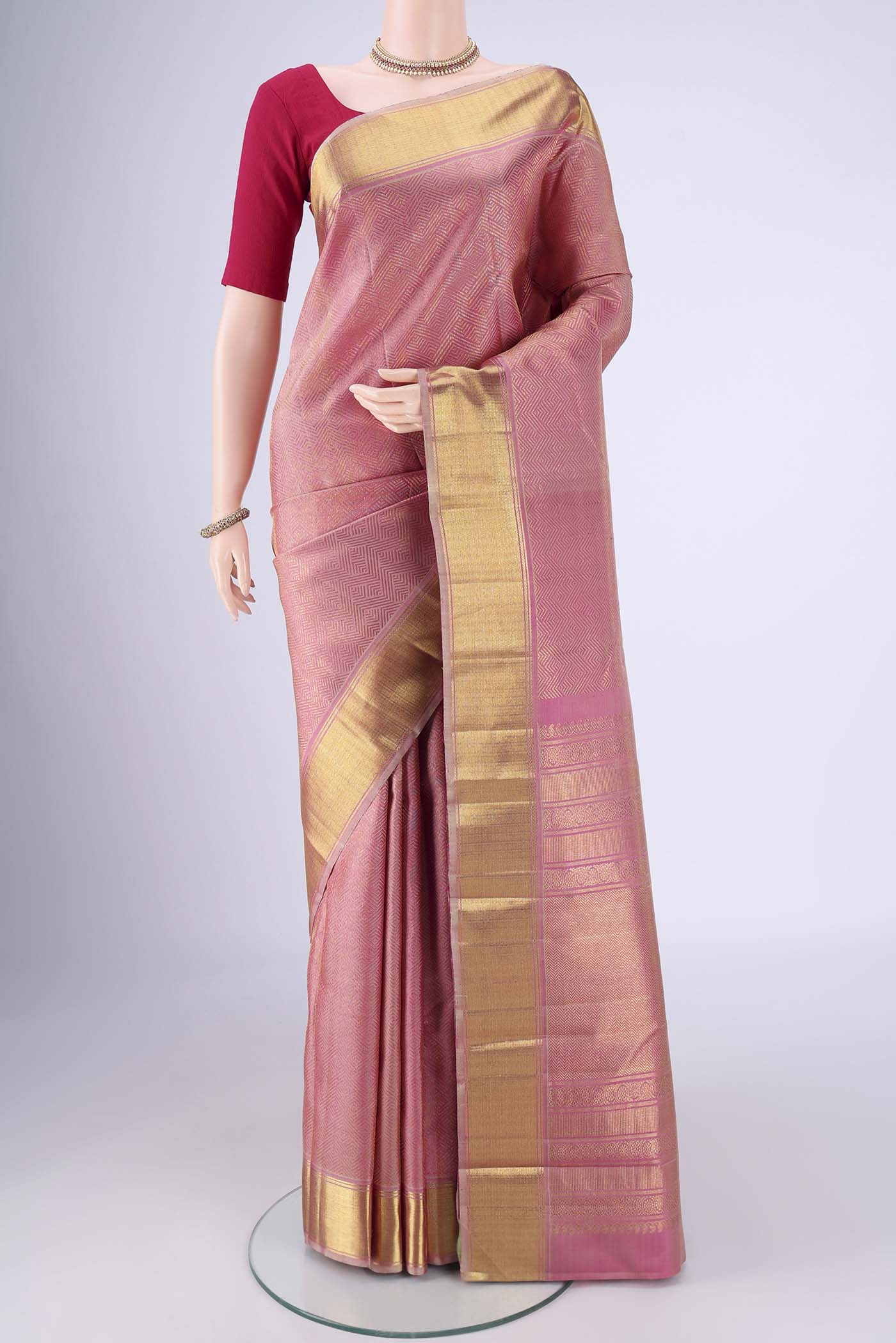 Pure Silk Pure Zari Rose pink Kanjivaram Saree with Zari Brocade on the body and Zari Border.  displayed on a mannequin