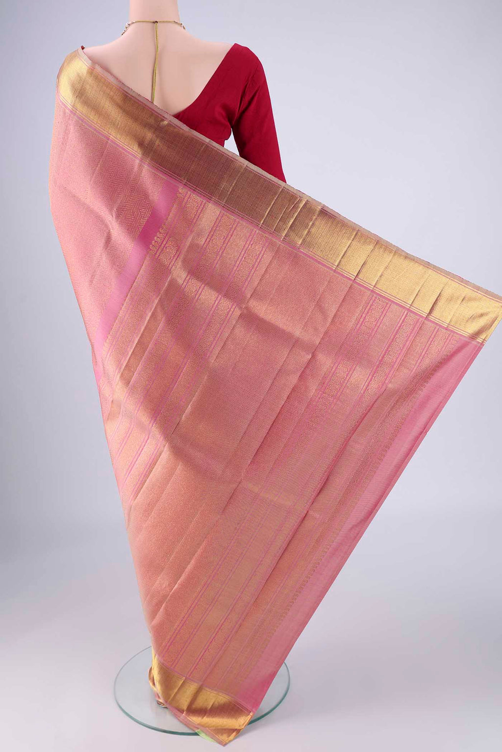 Flat view of Pure Silk Pure Zari Rose pink Kanjivaram Saree with Zari Brocade on the body and Zari Border. 