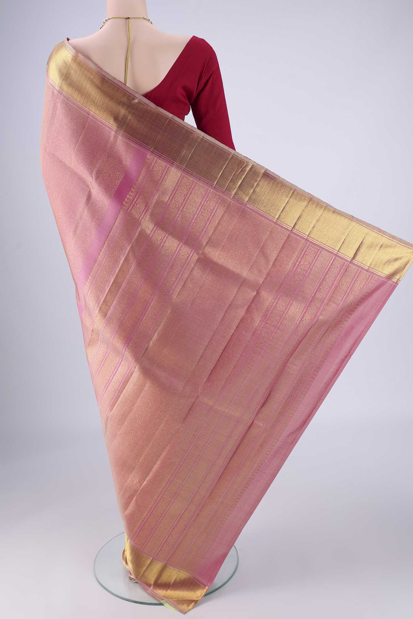 Flat view of Pure Silk Pure Zari Rose pink Kanjivaram Saree with Zari Brocade on the body and Zari Border. 