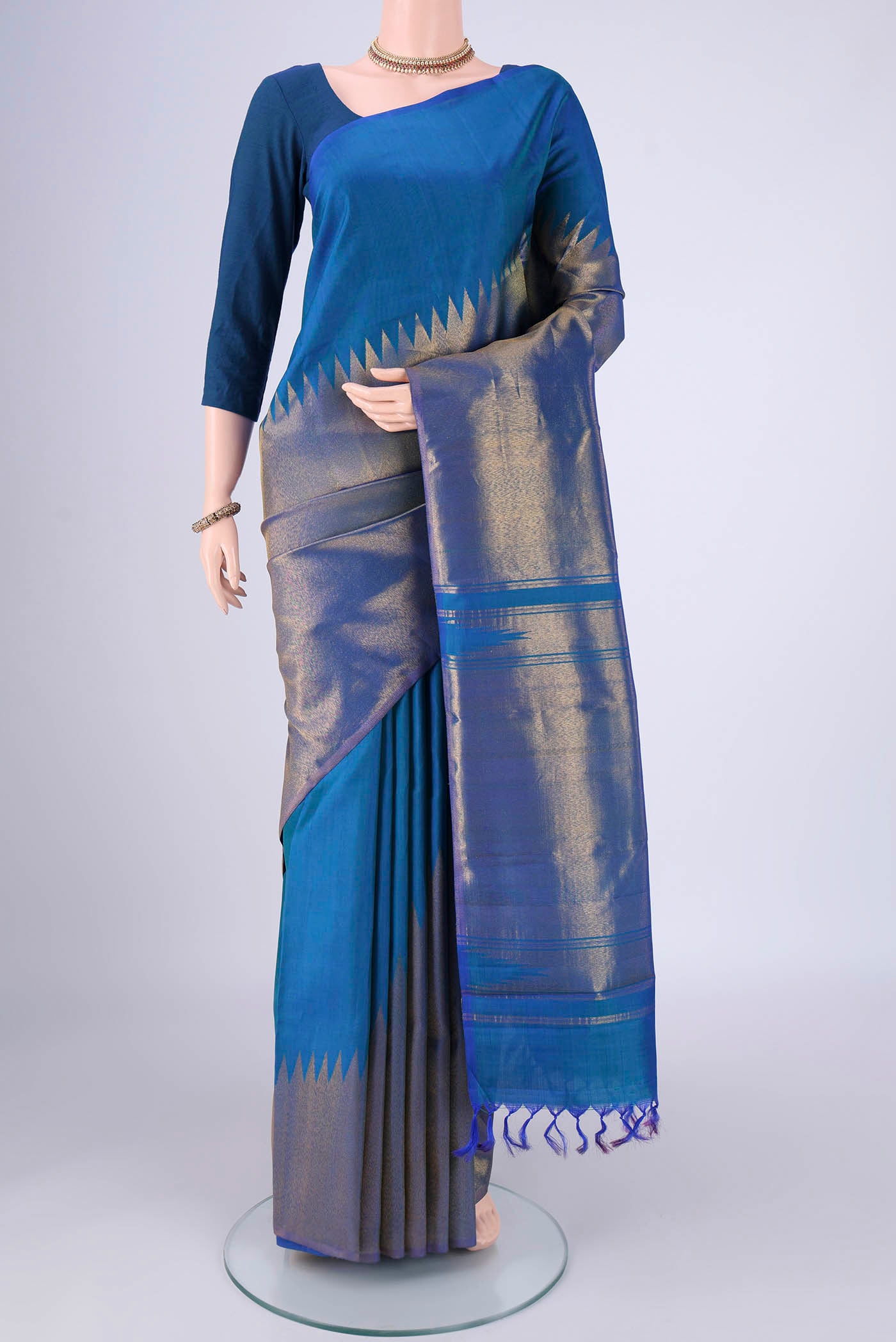Royal Blue Kanjivaram Silk Saree with Plain Body and Rising Temple Border.  displayed on a mannequin