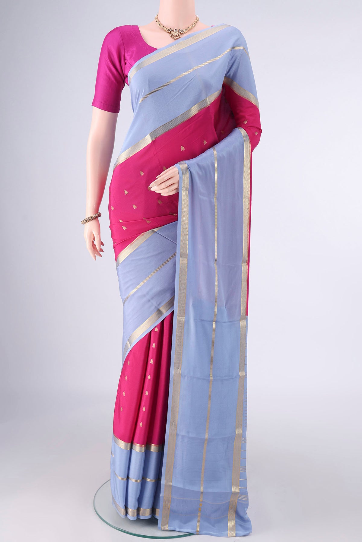 Pink Mysore Crepe Saree with Zari Butta on the body and Zari Border.  displayed on a mannequin