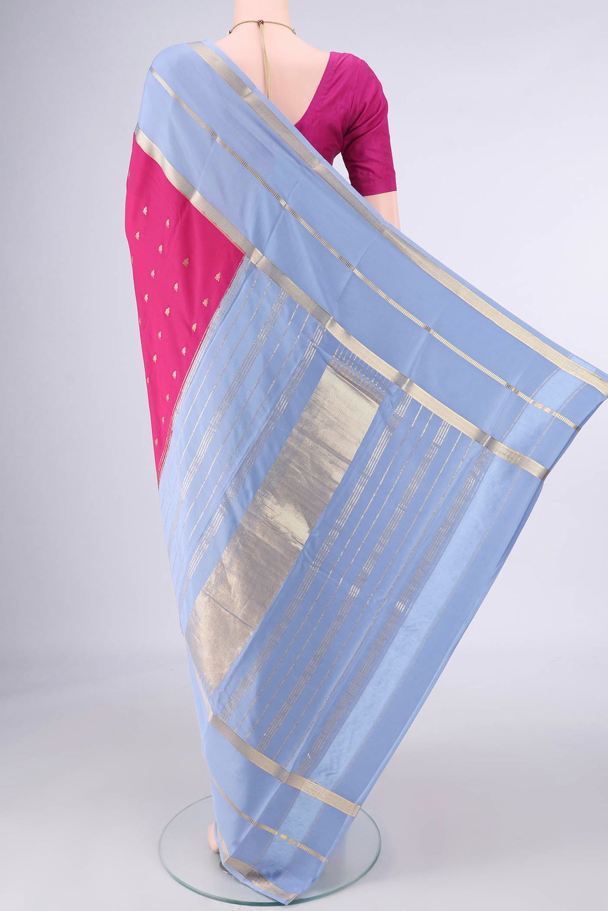 Flat view of Pink Mysore Crepe Saree with Zari Butta on the body and Zari Border. 