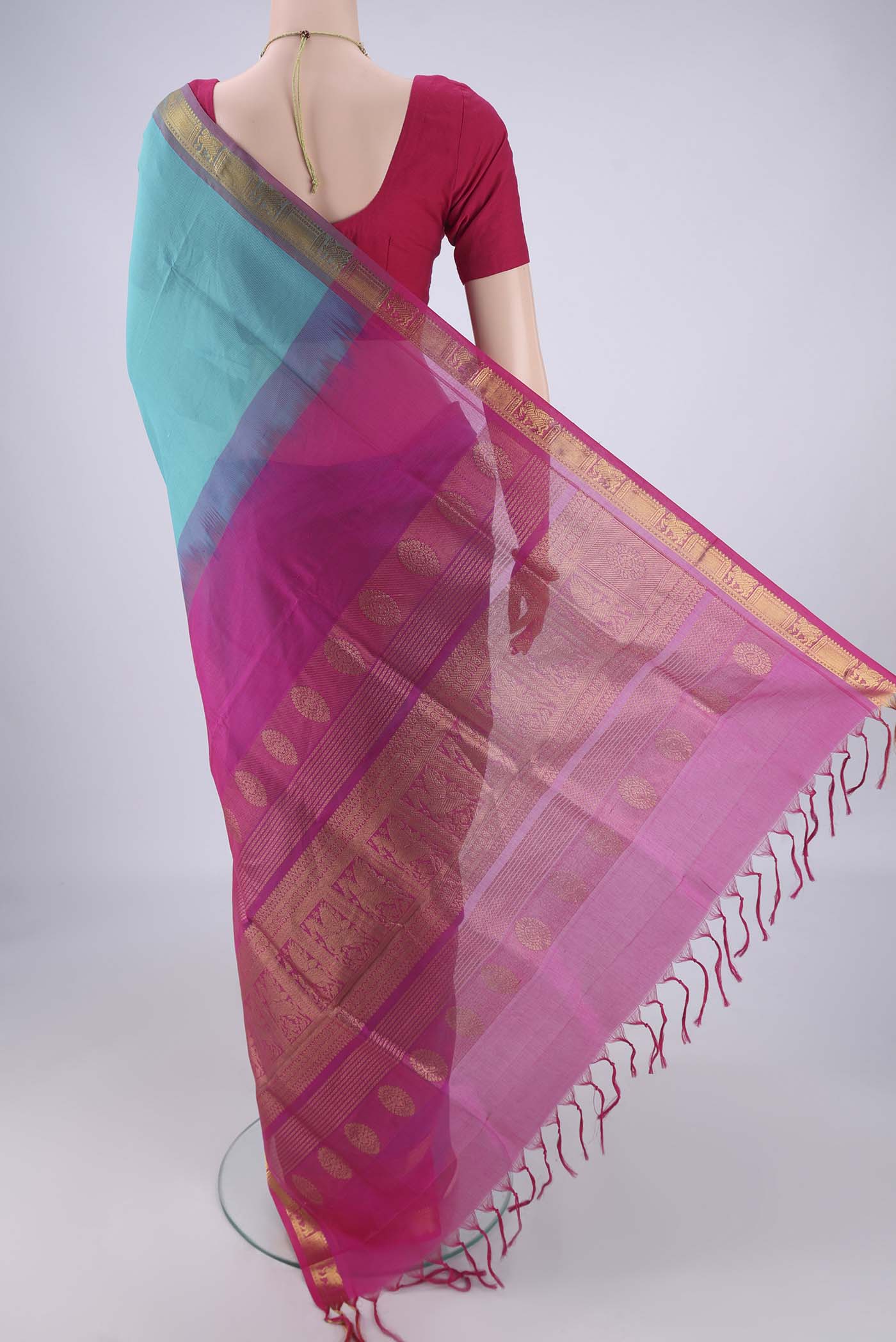 Flat view of Turquoise Silk Cotton Saree with Plain Body and Zari Border. 