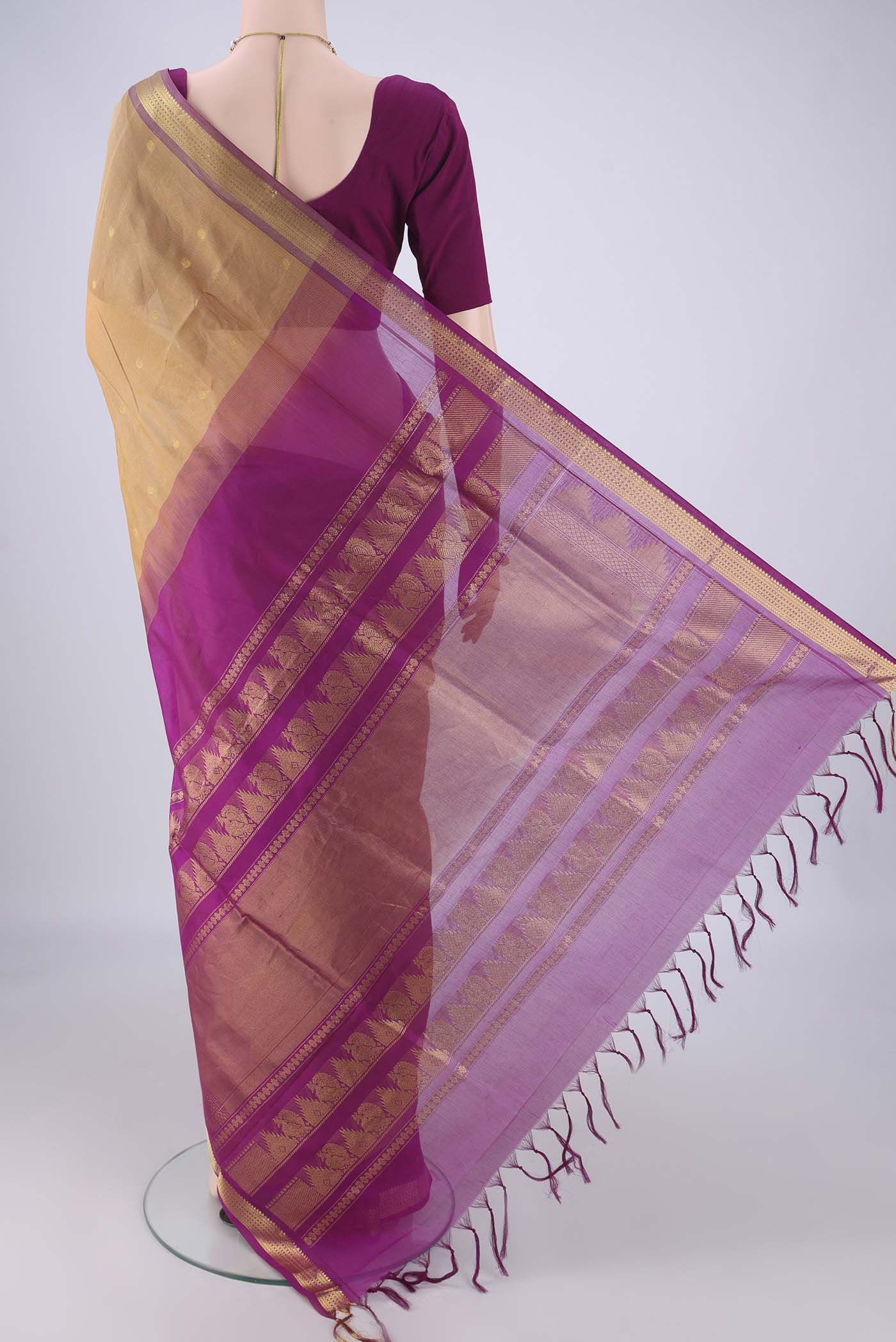 Flat view of Dark Beige Coimbatore Silk Cotton Saree with Zari Butta on the body and Zari Border. 