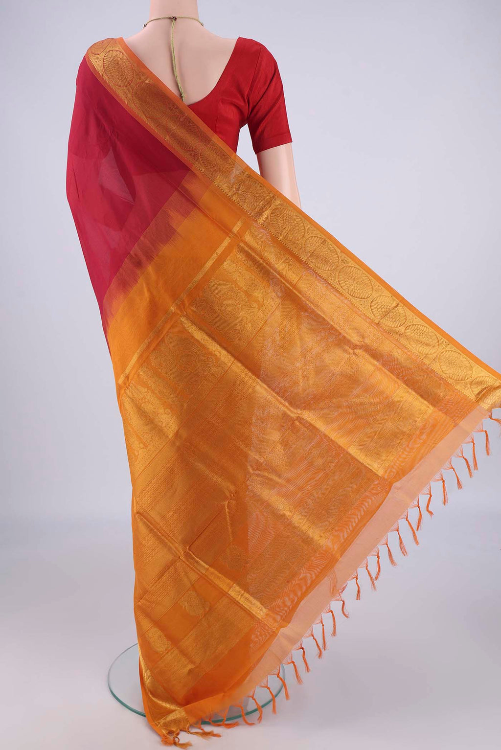 Flat view of Maroon Silk Cotton Saree with Plain Body and Zari Border. 