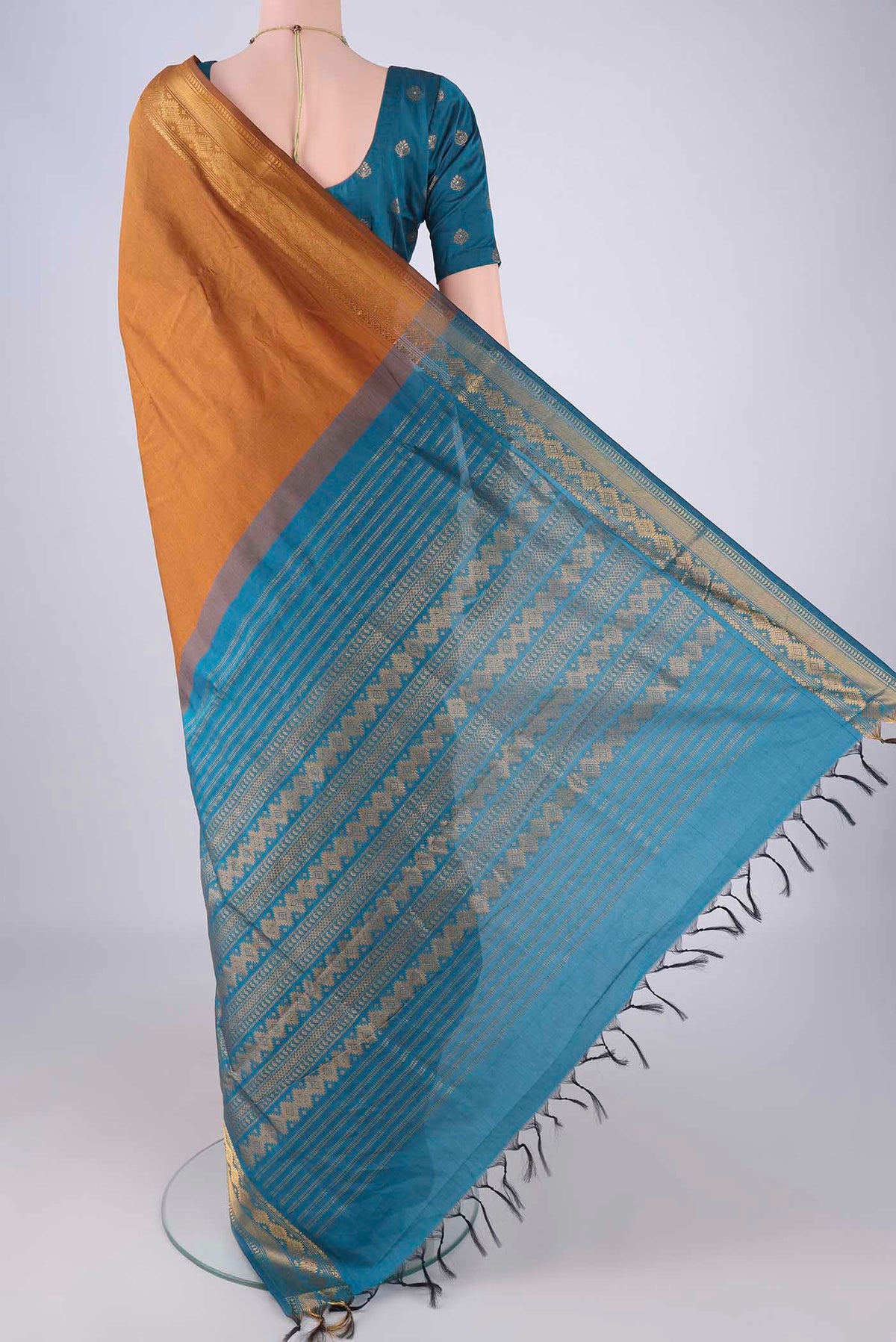 Flat view of Mustard Blended Poly Cotton Saree with Plain Body and Zari Border. 