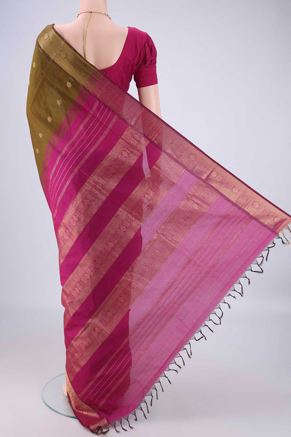 Flat view of Mehandi Green Poly Cotton Saree with Zari Butta on the body and Zari Border. 