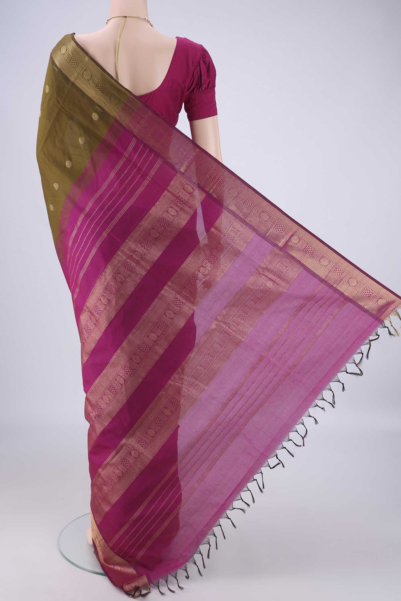 Flat view of Mehandi Green Poly Cotton Saree with Zari Butta on the body and Zari Border. 