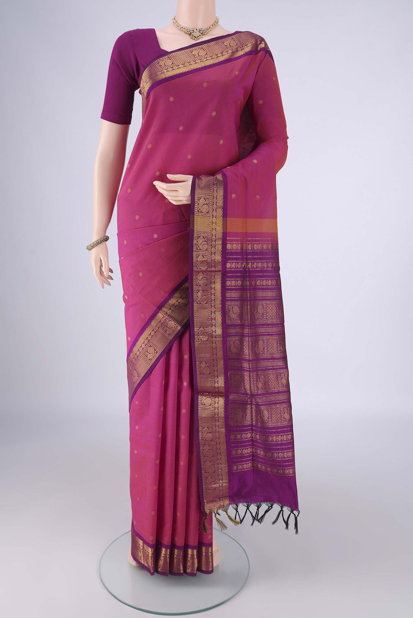 Dark Pink Blended Poly Cotton Saree with Zari Butta on the body and Zari Border.  displayed on a mannequin