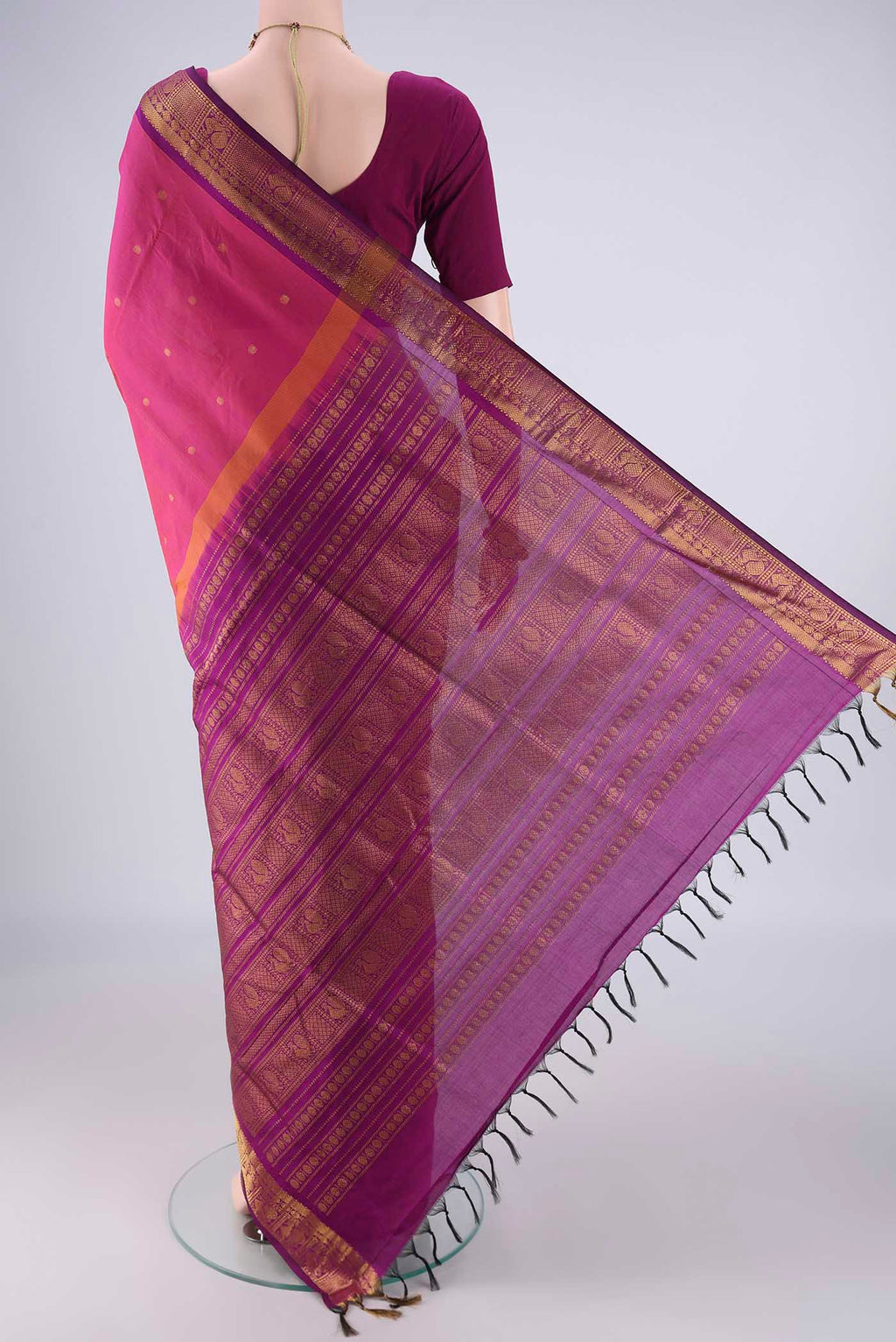 Flat view of Dark Pink Blended Poly Cotton Saree with Zari Butta on the body and Zari Border. 