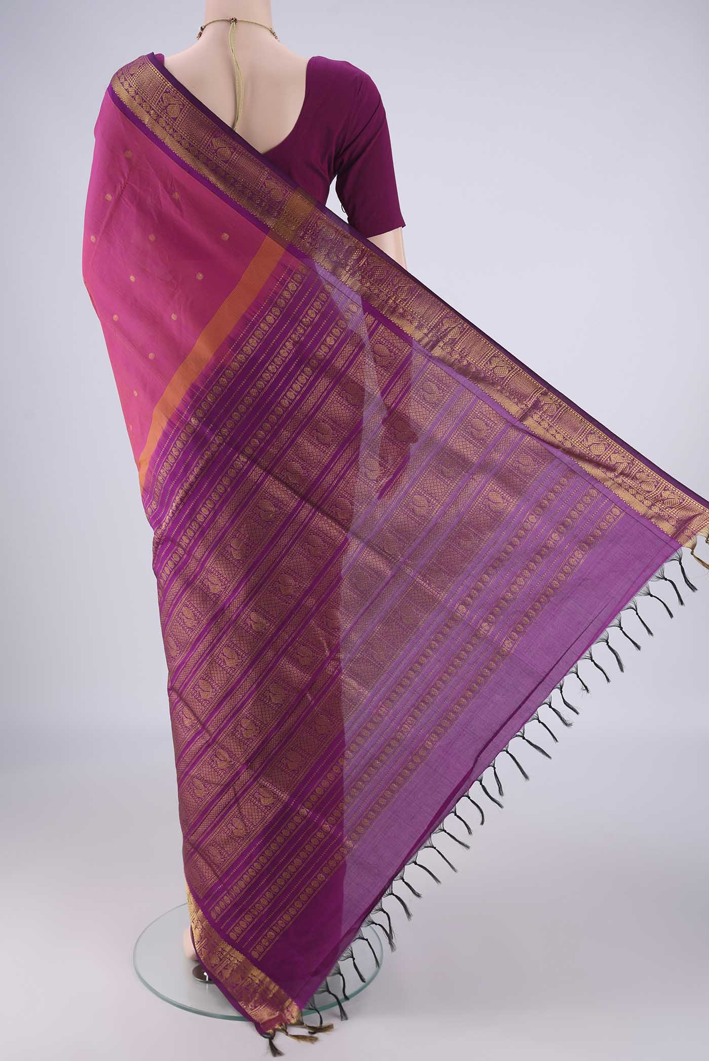 Flat view of Dark Pink Blended Poly Cotton Saree with Zari Butta on the body and Zari Border. 