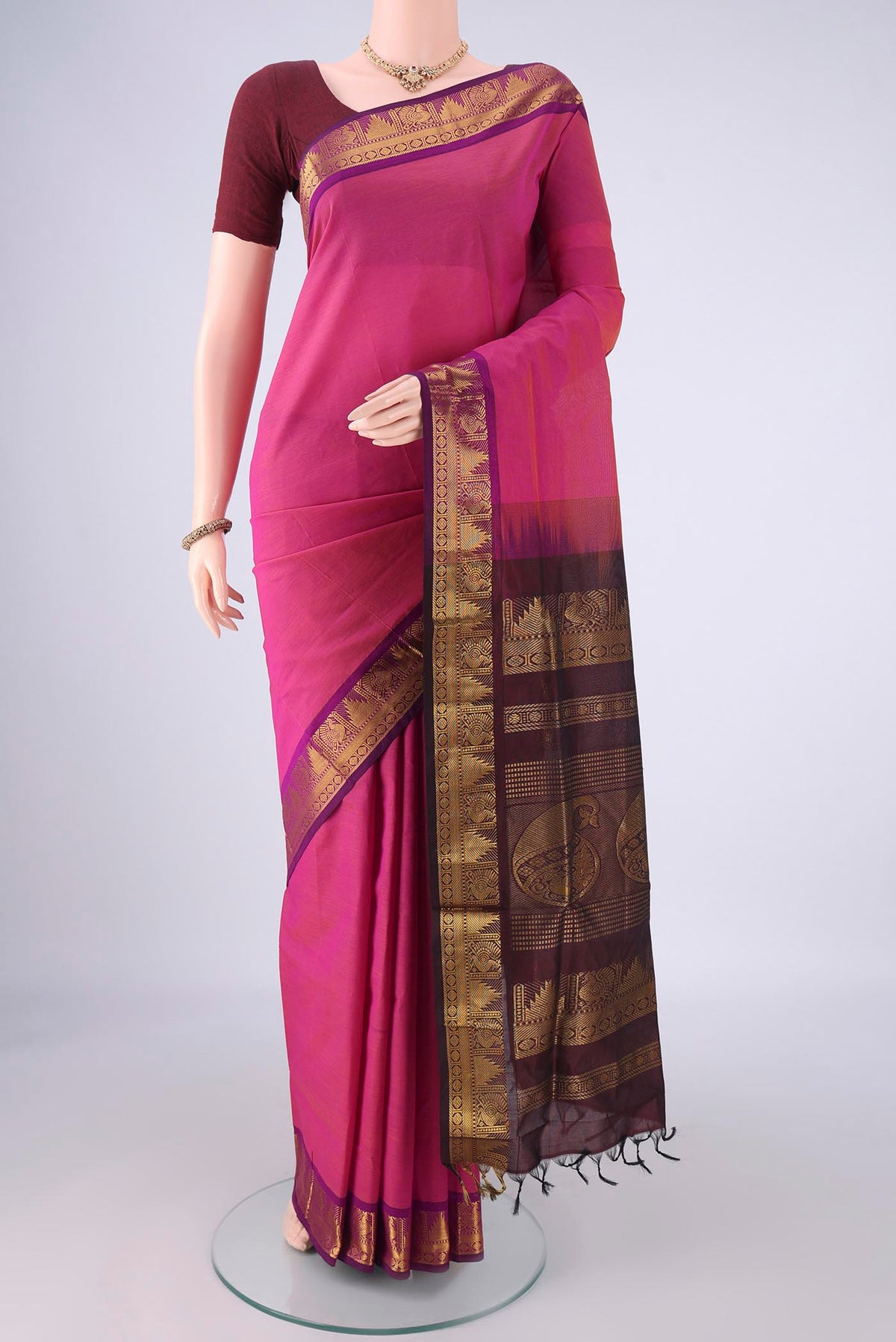 Light Magenta Blended Poly Cotton Saree with Plain Body and Zari Border.  displayed on a mannequin