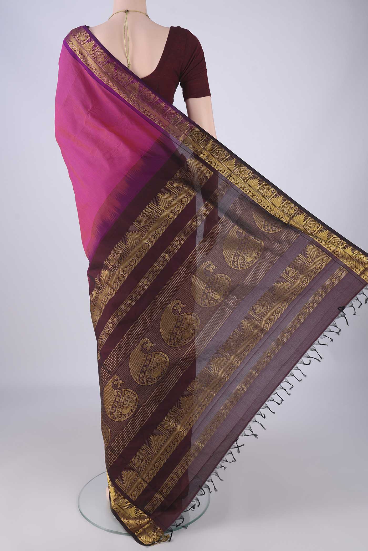Flat view of Light Magenta Blended Poly Cotton Saree with Plain Body and Zari Border. 
