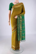 Mehandi Green Blended Poly Cotton Saree with Plain Body and Zari Border.  displayed on a mannequin