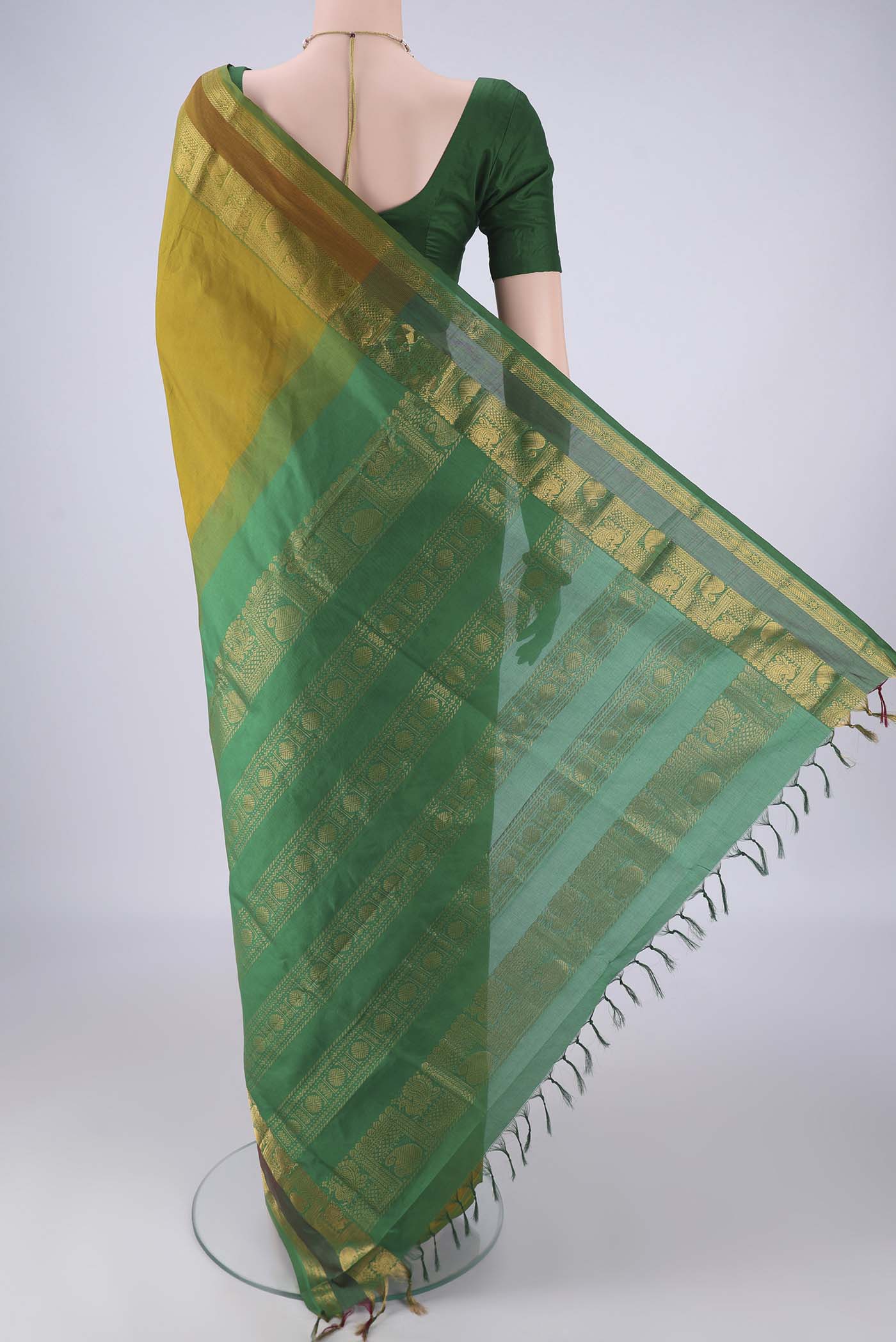 Flat view of Mehandi Green Blended Poly Cotton Saree with Plain Body and Zari Border. 
