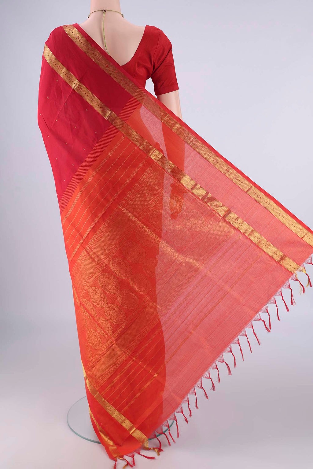 Flat view of Red Blended Poly Cotton Saree with Zari Butta on the body and Zari Border. 