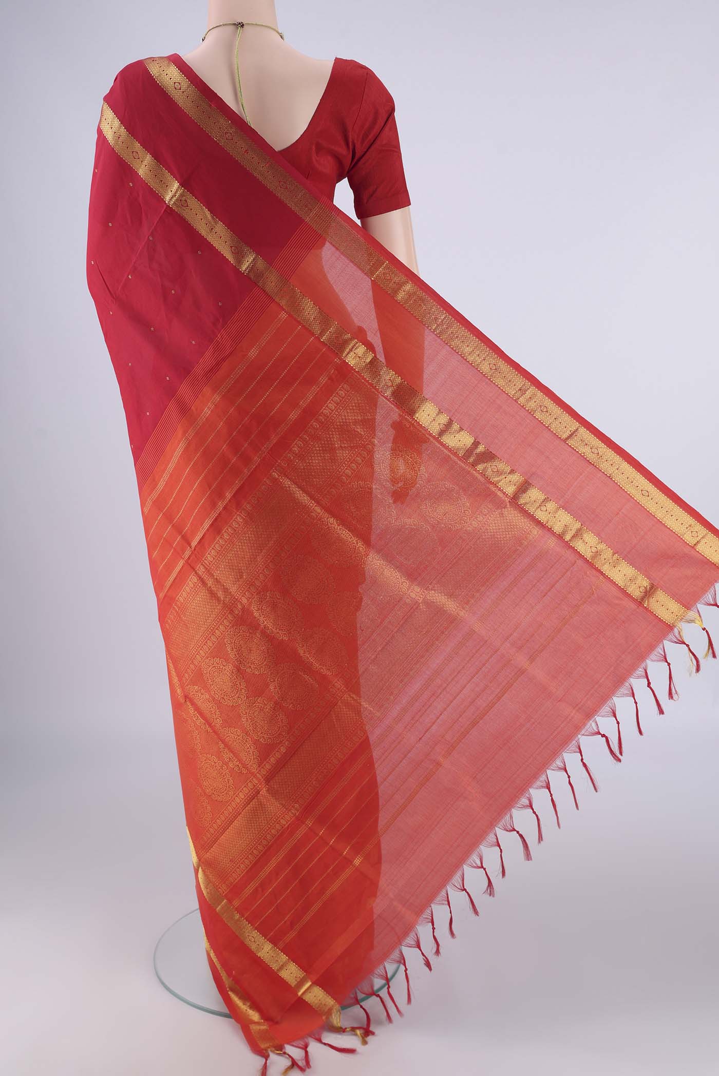 Flat view of Red Blended Poly Cotton Saree with Zari Butta on the body and Zari Border. 