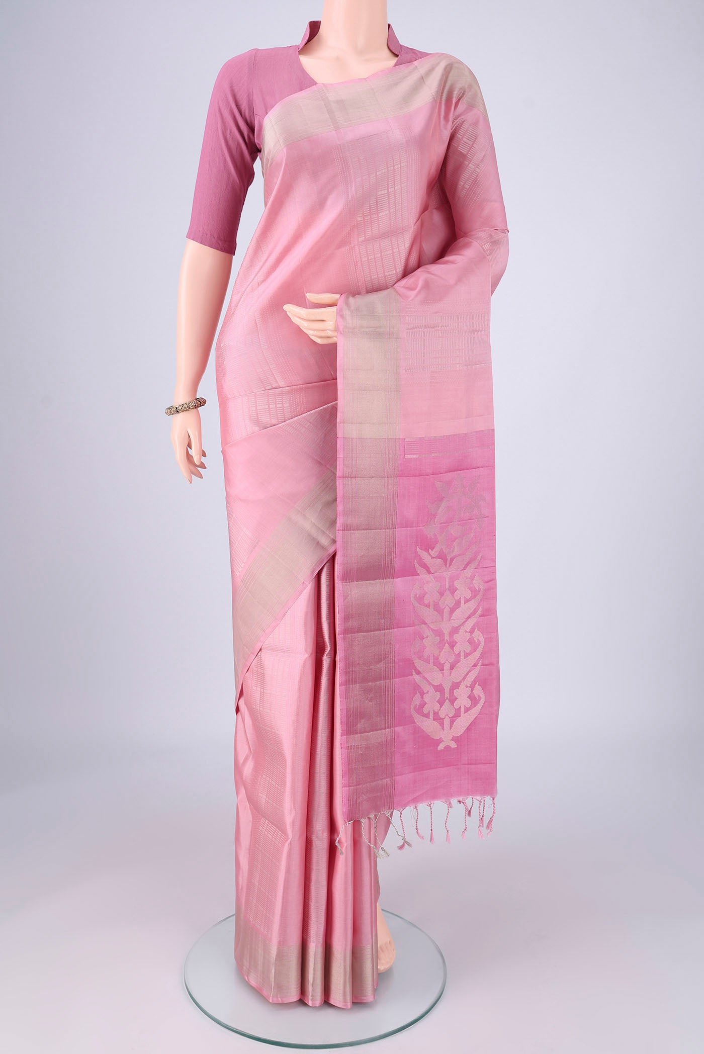 Rose pink Soft Silk Saree with Stripes on the body and Zari Border.  displayed on a mannequin