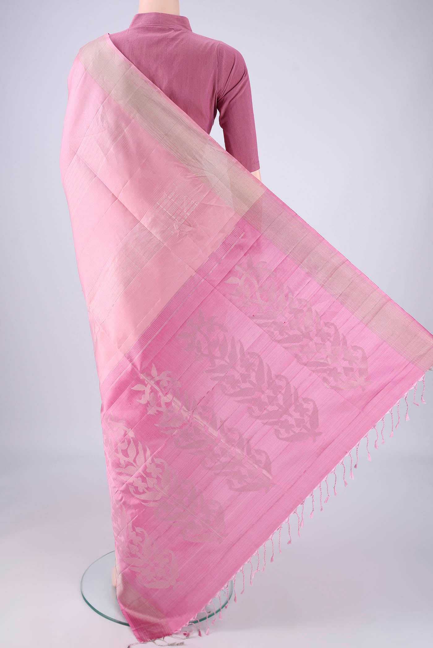Flat view of Rose pink Soft Silk Saree with Stripes on the body and Zari Border. 