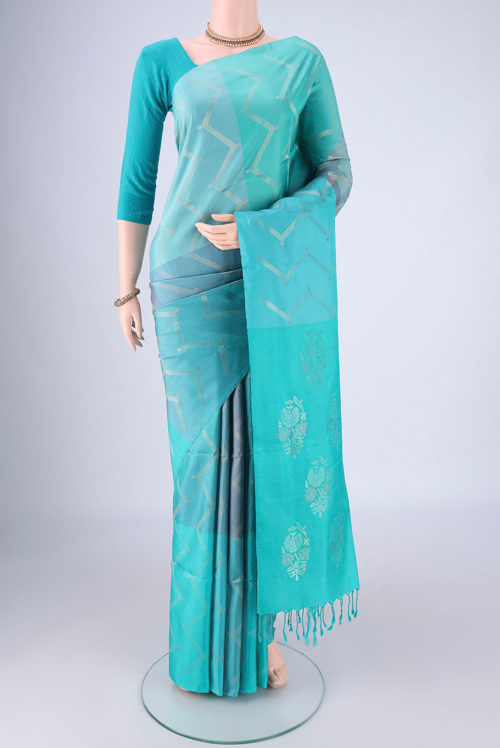 Multi Color Soft Silk Saree with Zari Butta on the body and Without Border.  displayed on a mannequin