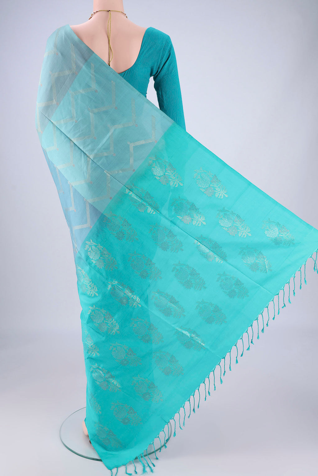 Flat view of Multi Color Soft Silk Saree with Zari Butta on the body and Without Border. 