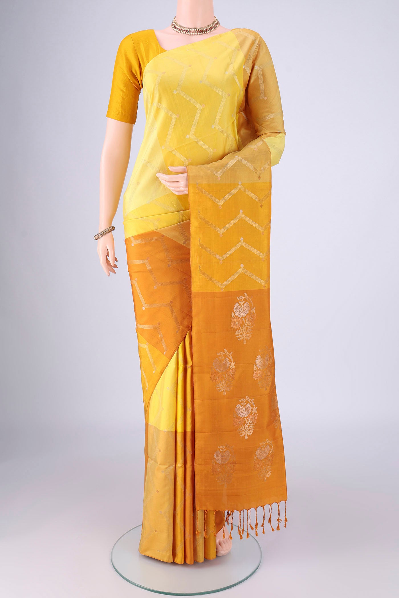 Multi Color Soft Silk Saree with Zari Butta on the body and Without Border.  displayed on a mannequin