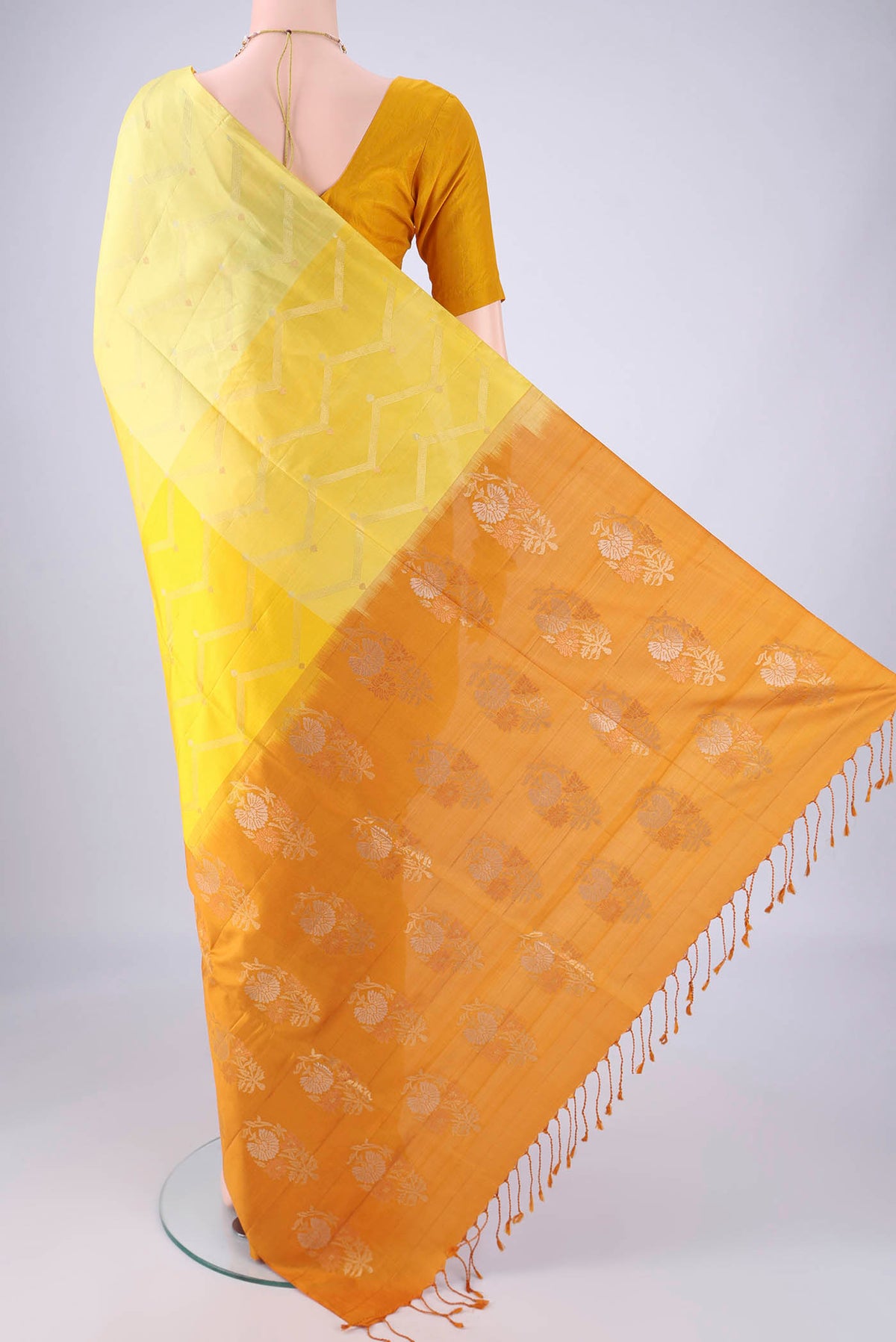 Flat view of Multi Color Soft Silk Saree with Zari Butta on the body and Without Border. 