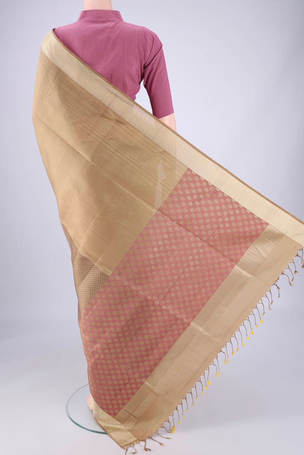 Flat view of Dark Beige Soft Silk Saree with Thread Butta on the body and Zari Border. 