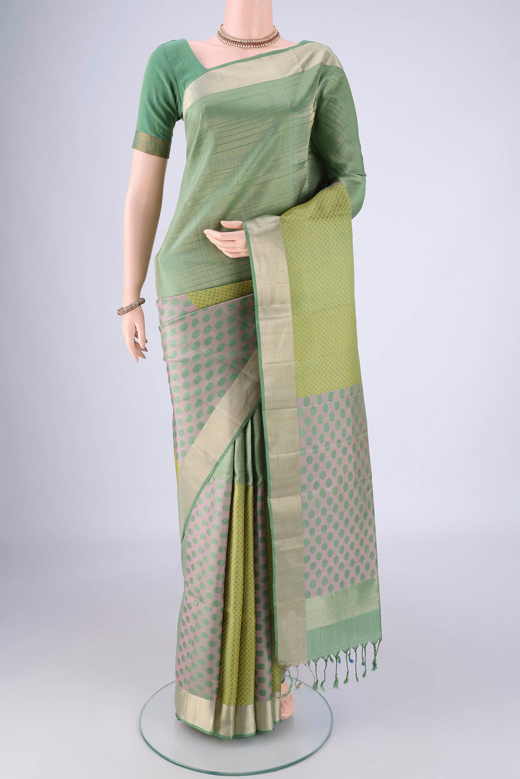 Multi Color Soft Silk Saree with Thread Butta on the body and Zari Border.  displayed on a mannequin