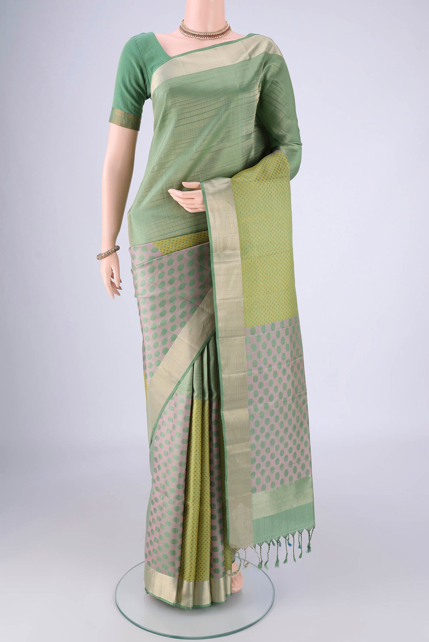 Multi Color Soft Silk Saree with Thread Butta on the body and Zari Border.  displayed on a mannequin